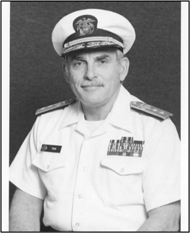 RADM Todd in summer white uniform with cover