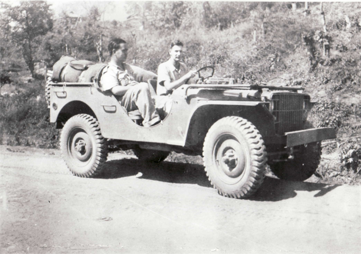 Sanitary Engineer Lawrence B. Hall and Sanitarian Frank W. Fisk (driving) in a jeep on the Burma Road, 1942.